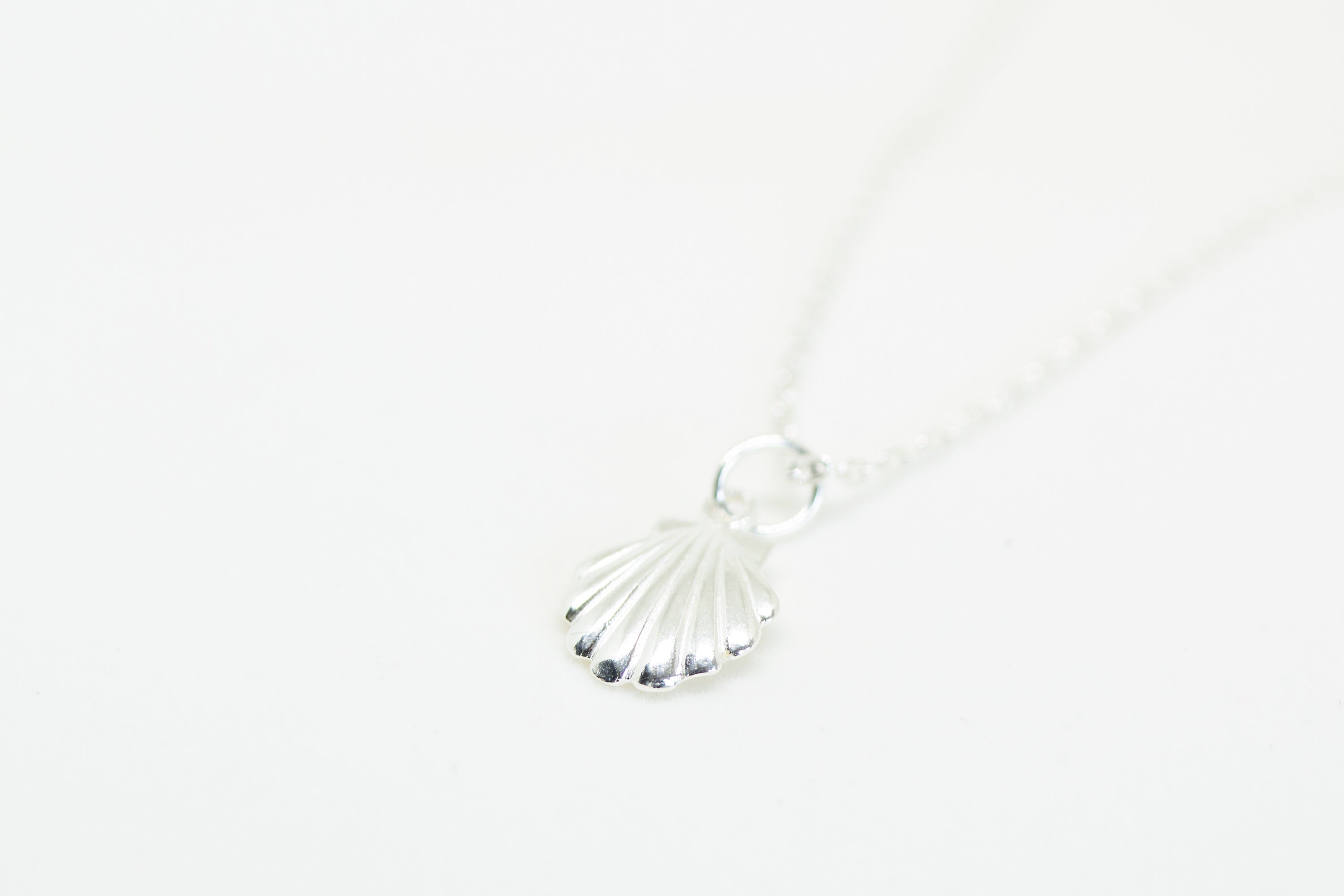 Coquillage charm Sølv