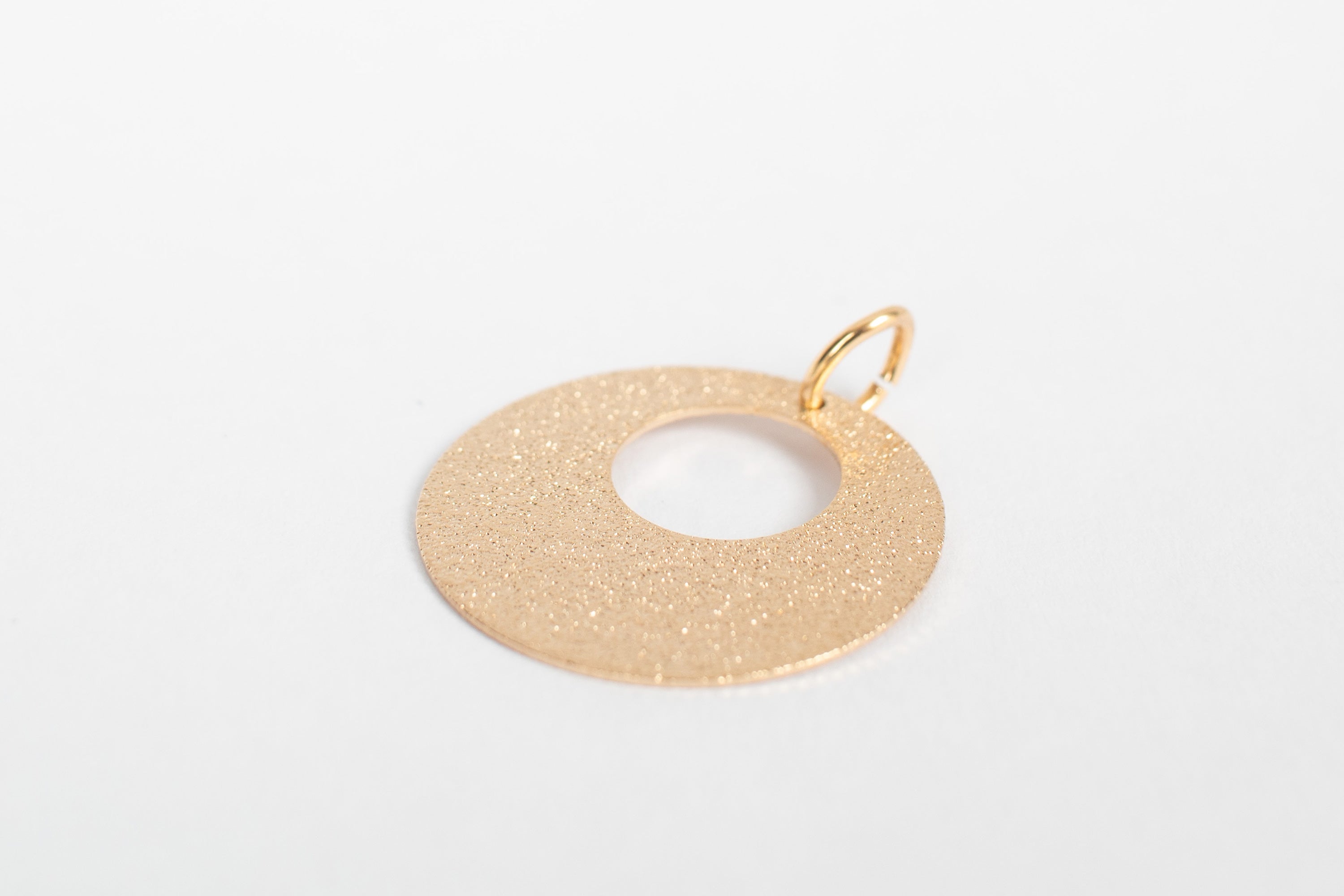 Disk sand charm