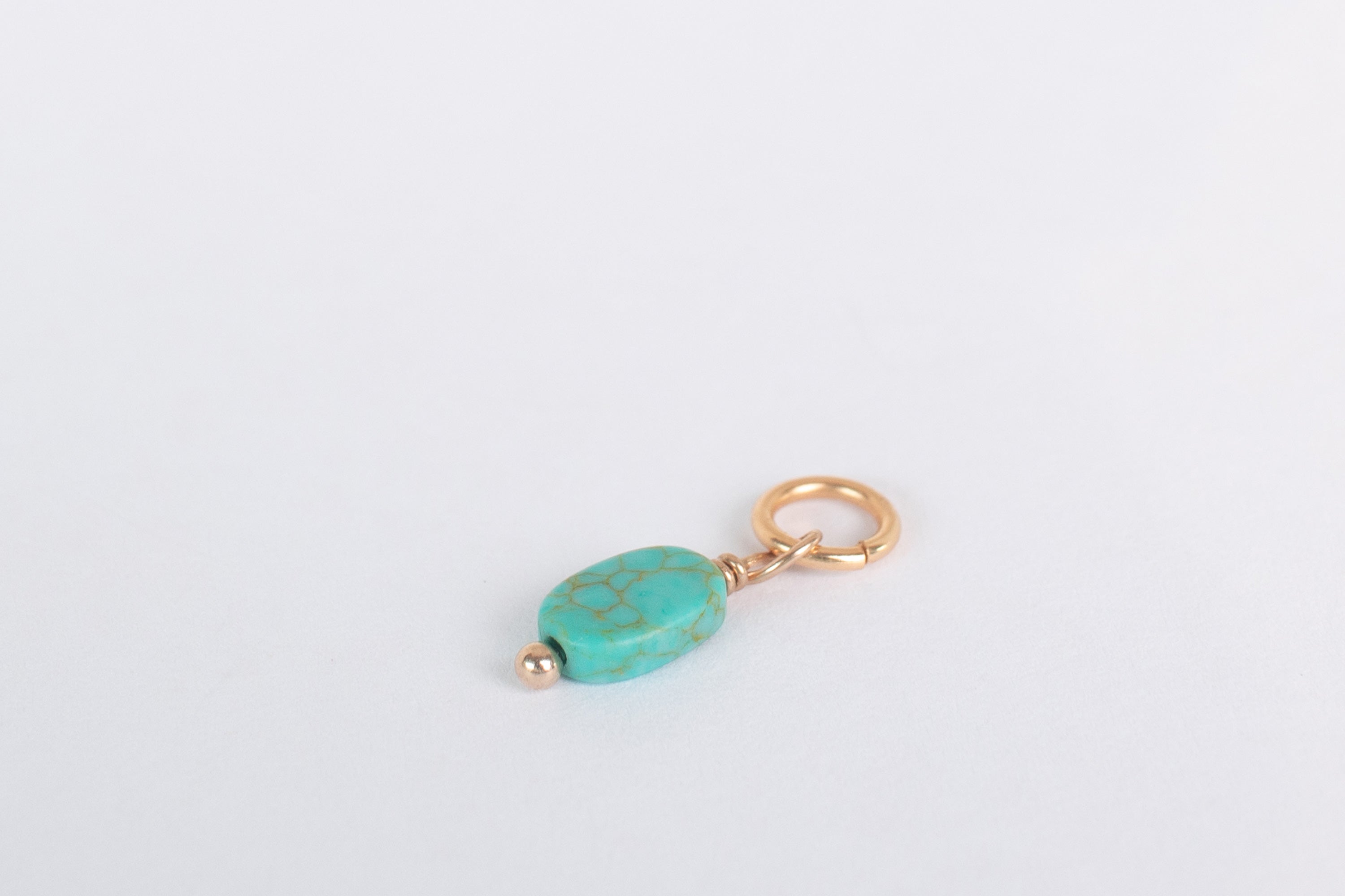 Liten turkis charm